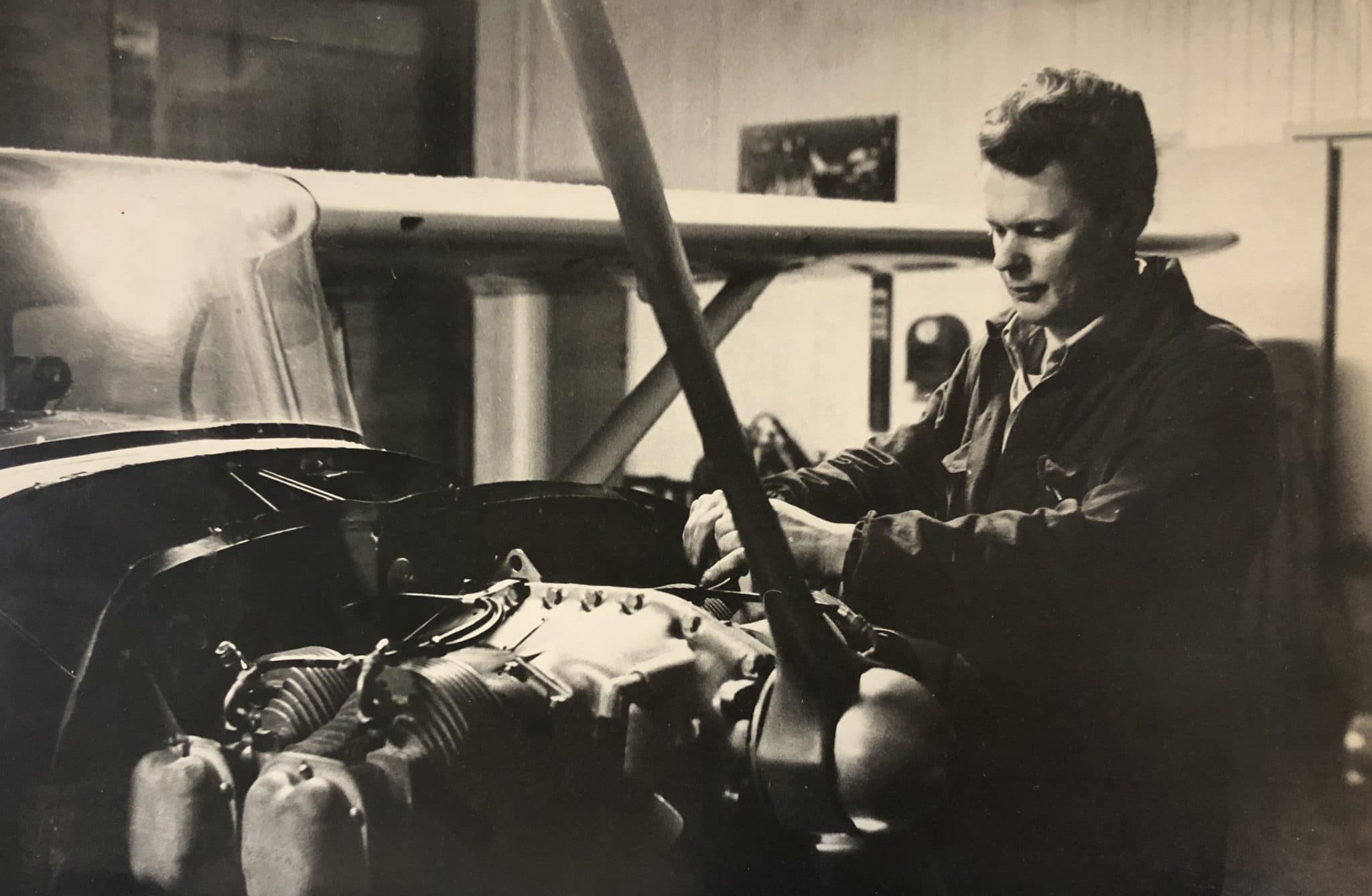 A young Rolf Svensson working on a light-aircraft engine in the hangar.